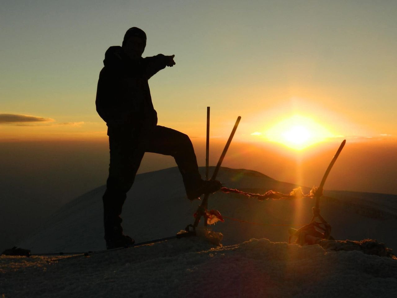 Essential climbing gear laid out for Mount Ararat expedition including boots, backpack, and technical equipment